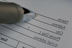 A pen filling out a form.